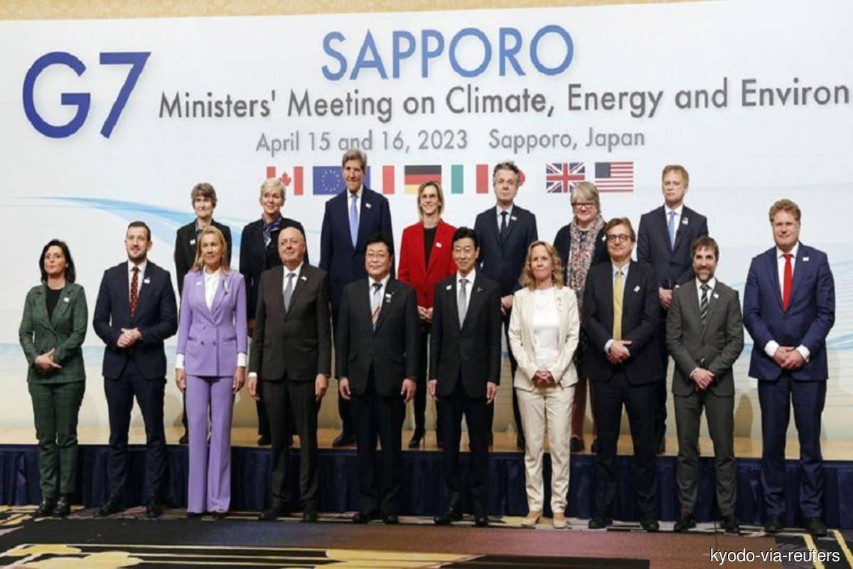 G7 Ministers' Meeting on Climate, Energy and Environment delegates pose for a photo session in Sapporo, Japan on Saturday, April 15, 2023 (Photo credit: Kyodo via Reuters)
